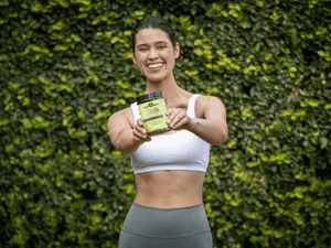 woman holding supplements